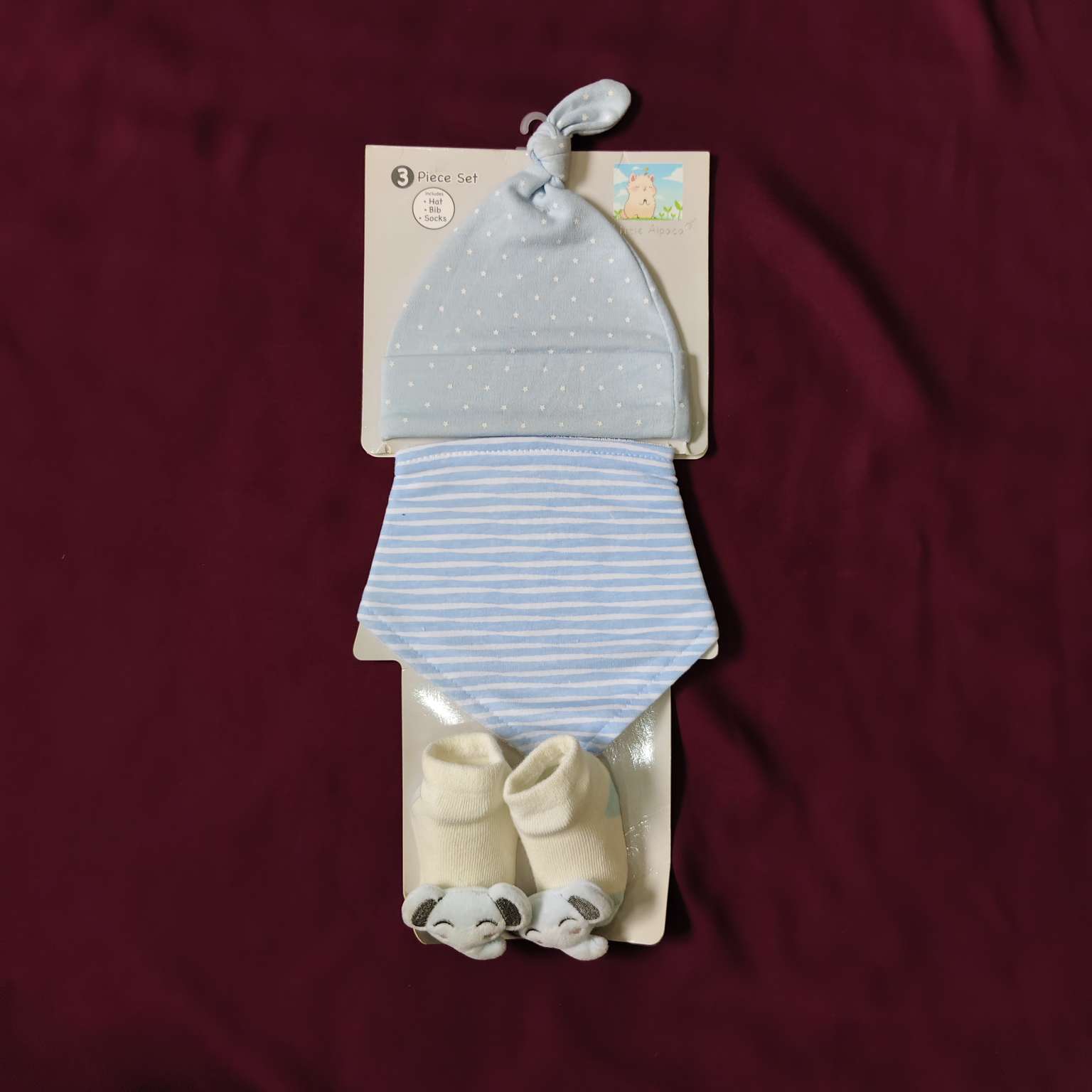 pack of cap, bib and booties (1)